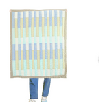 "Handcrafted cotton quilt with playful stripes & geometric patterns—soft, cozy bedding for kids’ cribs, toddler beds, twins & dorms." 