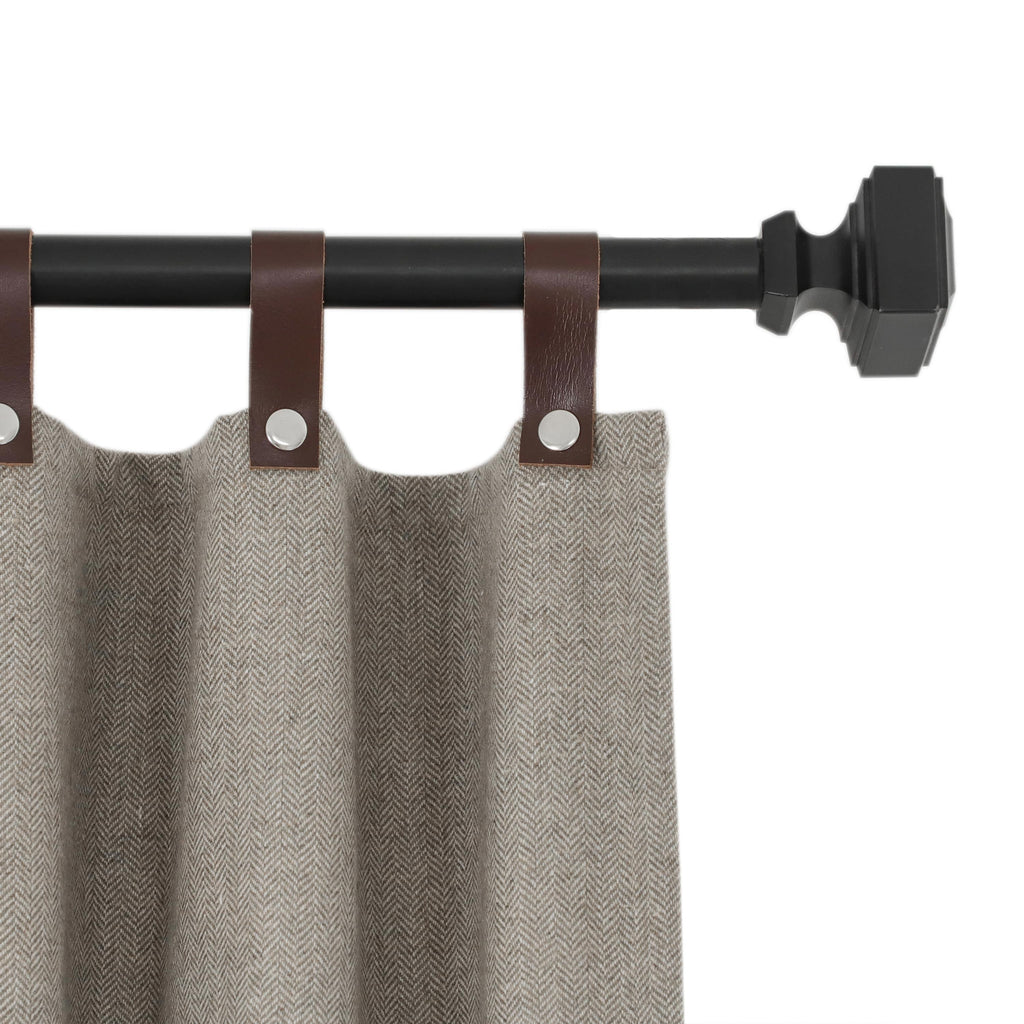 "Chevron wool curtains with snap-button leather tabs offer SPF 50+ UV protection, energy efficiency, and customizable light control."

