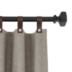 "Chevron wool curtains with snap-button leather tabs offer SPF 50+ UV protection, energy efficiency, and customizable light control."

