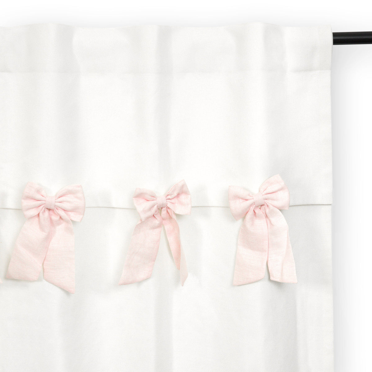 "Handcrafted bow valance curtain with reversible white cotton lining for privacy, light control, and optional blackout lining for naptime."
