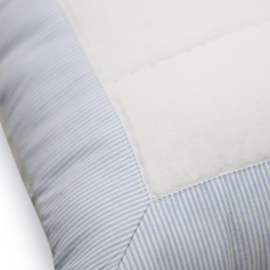 The quilted shams reverse to solid white fabric with envelop tie closure for a neat look.
