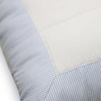 The quilted shams reverse to solid white fabric with envelop tie closure for a neat look.