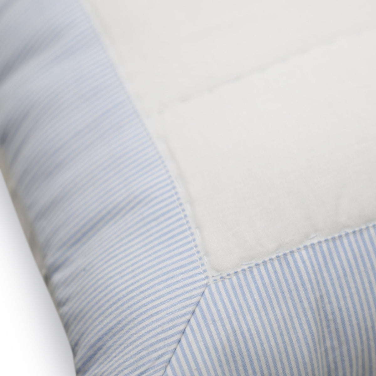 The quilted shams reverse to solid white fabric with envelop tie closure for a neat look.