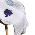 Traditional hand-quilted quilt features an elephant design in white and blue, offering an instant heirloom appeal. Perfect as the centerpiece of your nursery or kid's room.