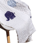 Traditional hand-quilted quilt features an elephant design in white and blue, offering an instant heirloom appeal. Perfect as the centerpiece of your nursery or kid's room.