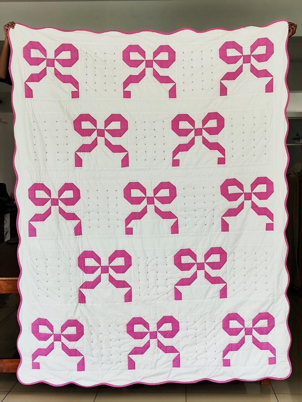 Handmade pink bow quilt with cotton patchwork, available in lap quilt, twin quilt. King and queen sizes. Perfect for girls’ room and dorm décor.
