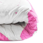 Handmade pink bow quilt, perfect for dorm décor, available in lap, twin, king, and queen sizes with soft cotton patchwork.