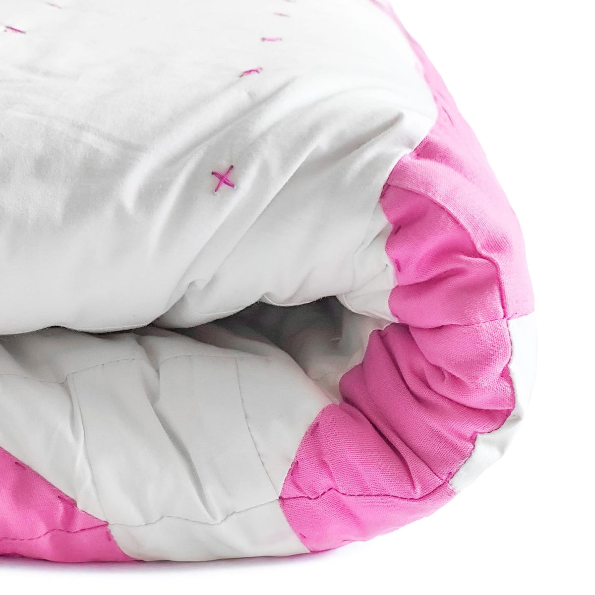 Handmade pink bow quilt, perfect for dorm décor, available in lap, twin, king, and queen sizes with soft cotton patchwork.