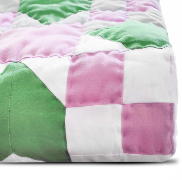 Handmade modern boho quilt – green pink white color block pattern for trendy bedroom decor.