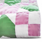 Handmade modern boho quilt – green pink white color block pattern for trendy bedroom decor.