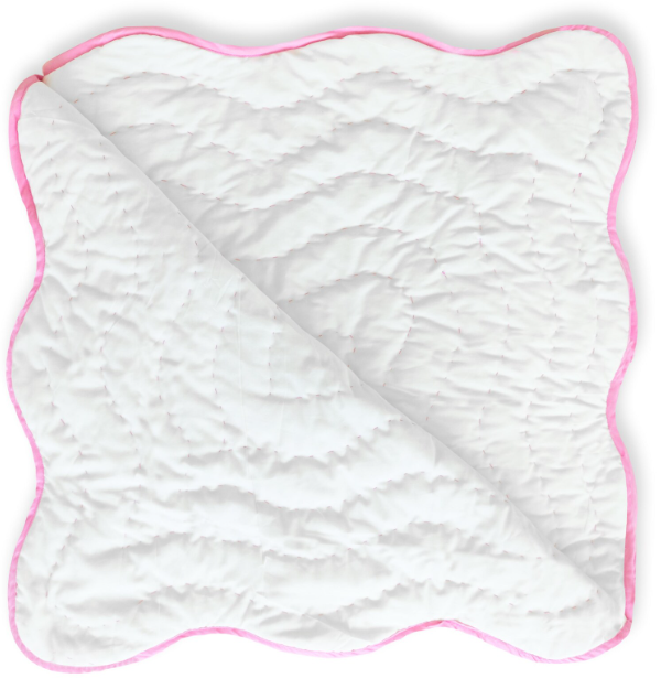 Close-up of soft pink handmade quilt, breathable cotton baby bedding, lightweight toddler blanket, cozy nursery essential for a stylish baby room.
