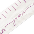 "Girls' room wall decor—custom embroidered growth chart with family name, pastel colors, and marked height measurements for memories."