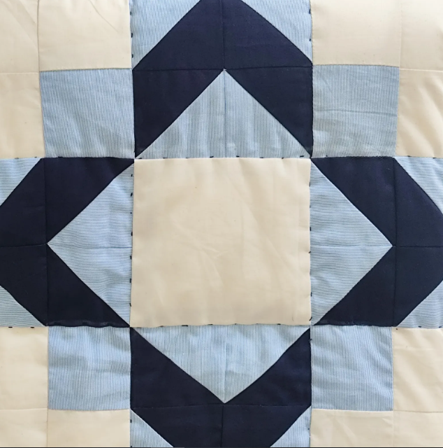 Handmade, breathable cotton quilt in a navy and ivory geometric pattern. Lightweight lap blanket, ideal for year-round use. Available in all sizes, including twin size beds and boys' dorm blankets.